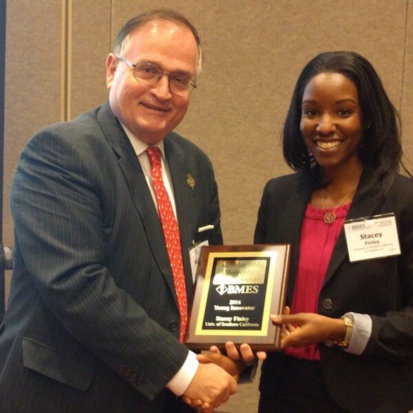 Stacey Finley receives her CMBE Journal Young Innovator Award from 2016 BMES Pritzker Award recipient Nicholas Peppas at the 2016 BMES Annual Meeting held October 5-8 in Minneapolis. Photo Courtesy of Viterbi Staff