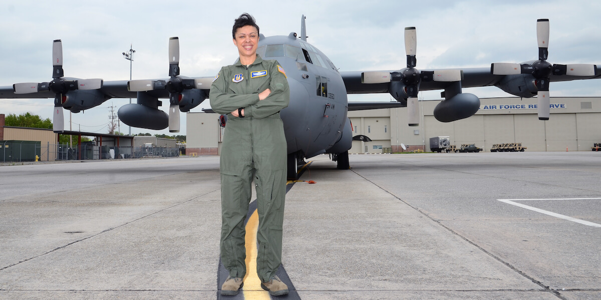 Lt. General Stayce Harris at the 94th Airlift Wing base in front of a Lockheed C-130 Hercules. Photo courtesy of U.S. Air Force