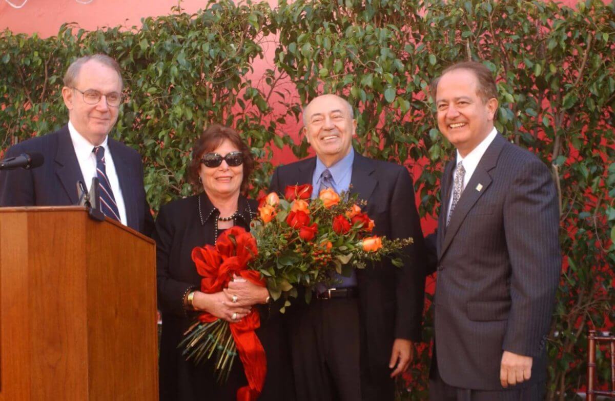 L-R: USC President Steven Sample, Erna and Andrew Viterbi, holding a bouquet of flowers, and Engineering School Dean C. L. Max Nikias.