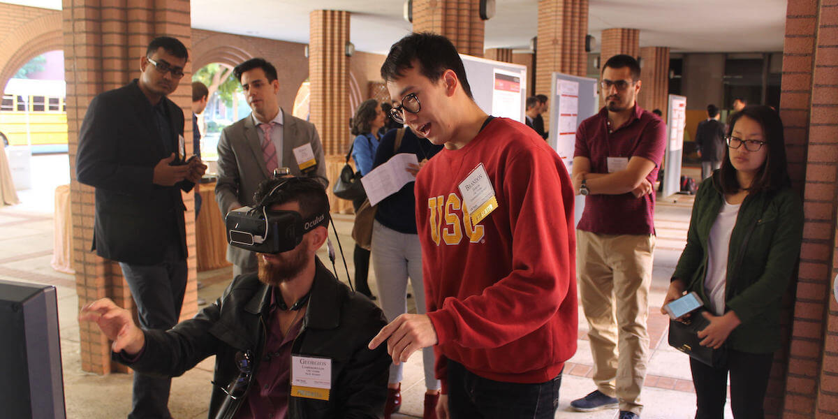 Undergraduate student Brandon Horton shows off his research to attendees at the 7th Annual Electrical Engineering Research Festival. Photo Credit USC Viterbi