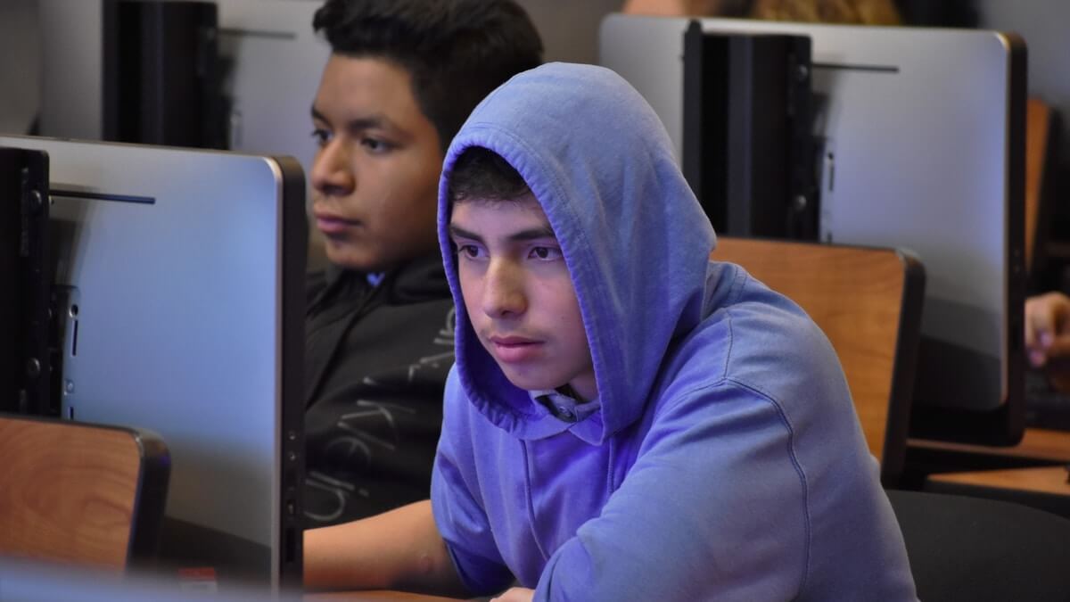 Hollenbeck Middle School student intently concentrating on his code. Photo by Nick Nuccio.