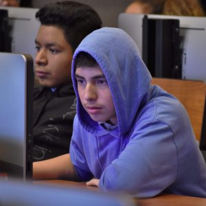 Hollenbeck Middle School student intently concentrating on his code. Photo by Nick Nuccio.