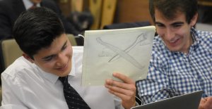 Viterbi students Lorand Cheng and Baran Cinbis demonstrate a rough sketch of their aircraft design. Photo credit: Nick Nuccio