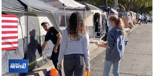 Students delivering temperature relief tarps for homeless in Los Angeles. PHOTO/ Spectrum News.
