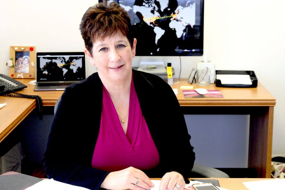 A photo of Terry Benzel at her desk at ISI