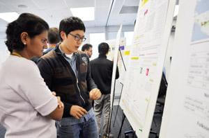 A photo of two students at Graduate Student Symposium