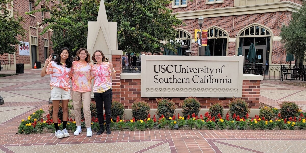 USC students in tie-dye T-shirts on USC University Park Campus.