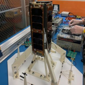The USC Dodona satellite in stowed position on the vertical integration stand undergoing test.