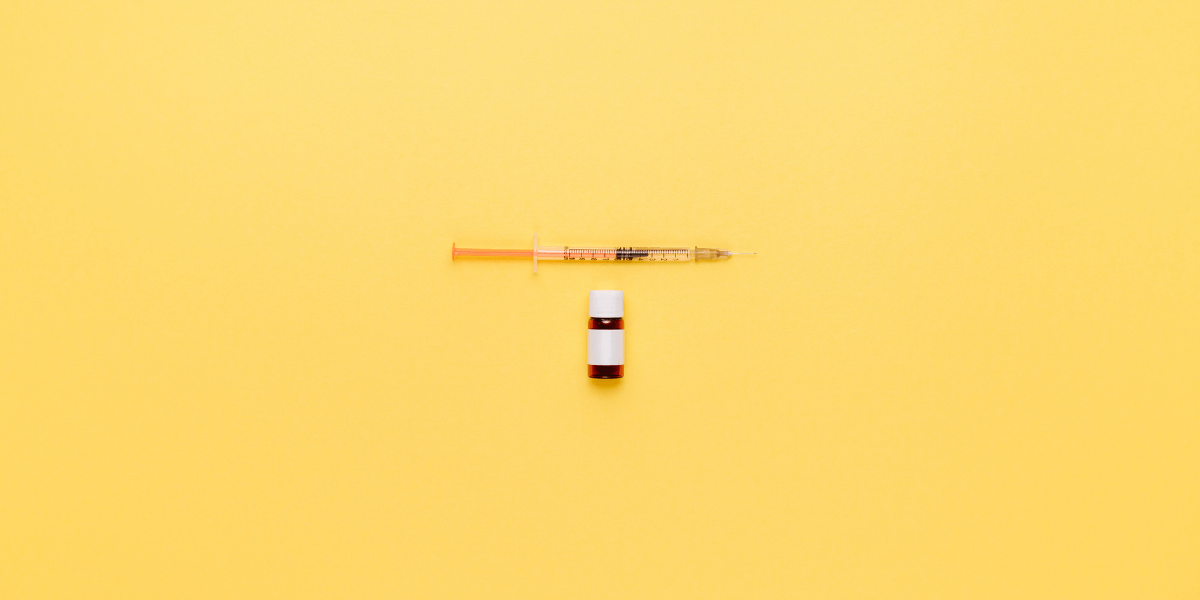 syringe and vaccine bottle