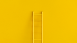 A ladder on a yellow background