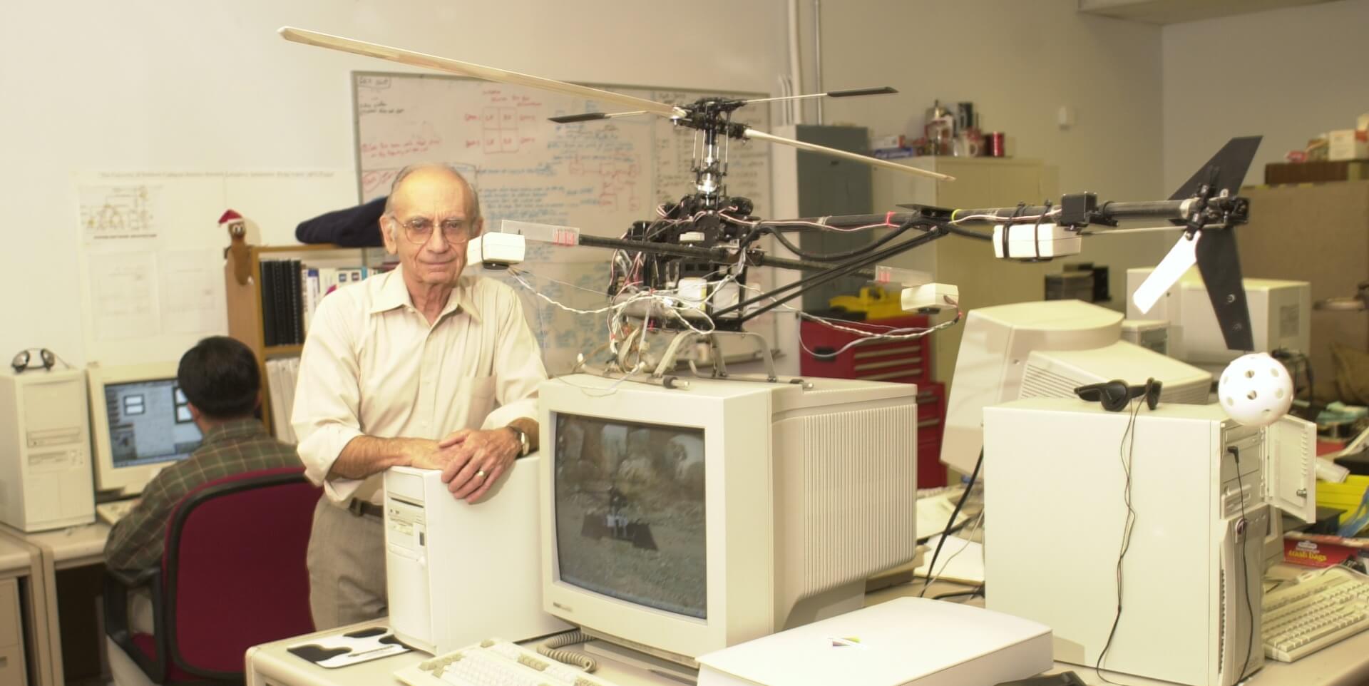 Bekey in his lab, approximately 1998, with a helicopter he built with his students. Some of the technology from this project went directly into the helicopter that recently flew on Mars (PHOTO CREDIT: Michelle Bekey)