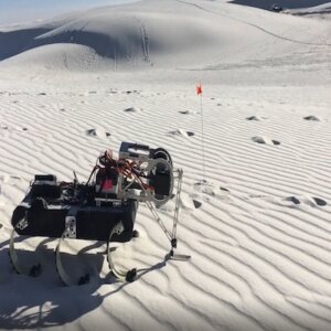 One of the two-legged robots measuring the strength of the regolith during a previous field campaign in White Sands, New Mexico.  Photo/courtesy Feifei Qian