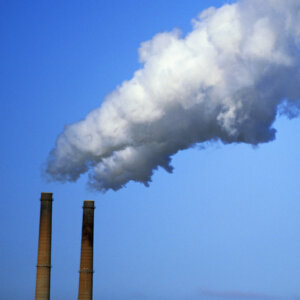 Factory stacks expelling emissions