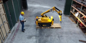 Construction worker operating an robot