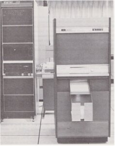 Xerox Graphics Printer at ISI showing the PDP-11 interface to the left and a teletype machine in the background.