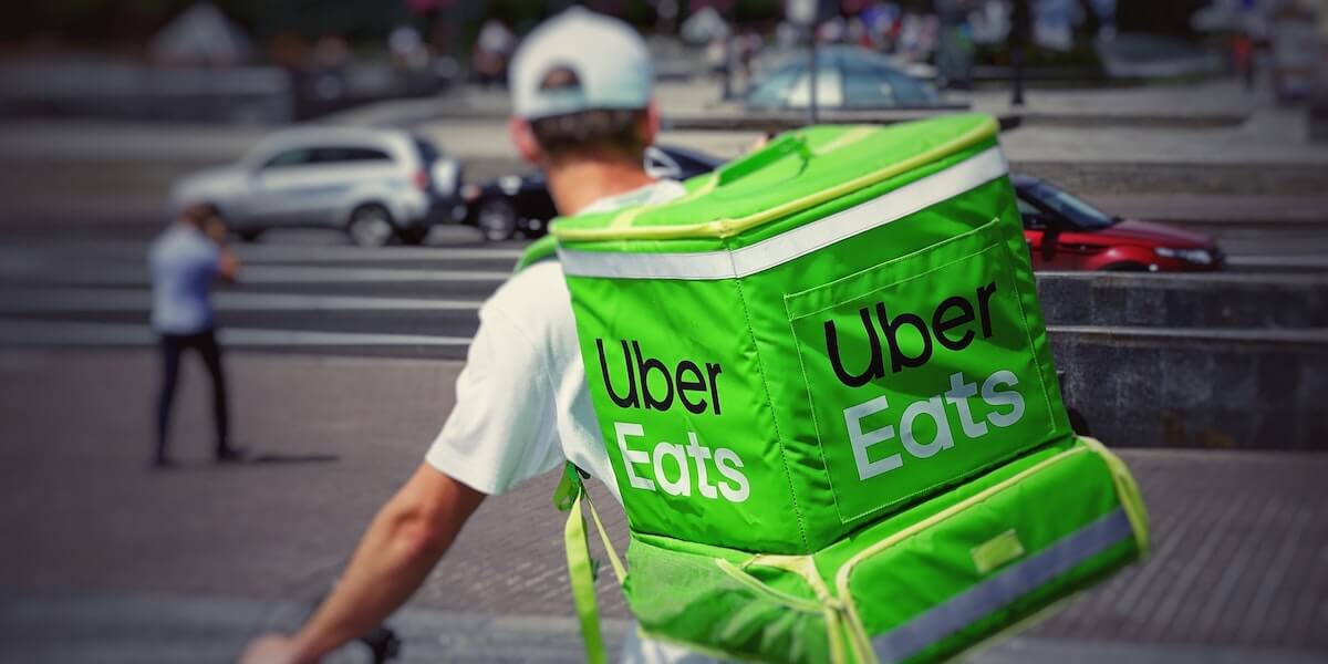 A cyclist delivers for Uber Eats. Image/Robert Anasch.