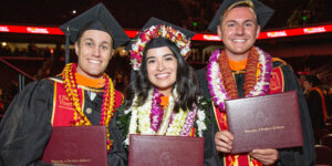 2023 USC Viterbi master's students with their diplomas