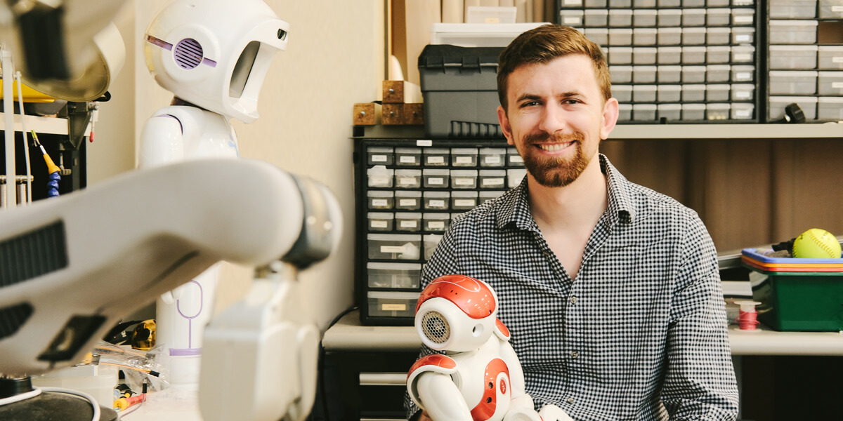 Chris Birmingham is developing robotic technologies to support people coping with difficult health conditions, such as cancer. Photo/Keith Wang.