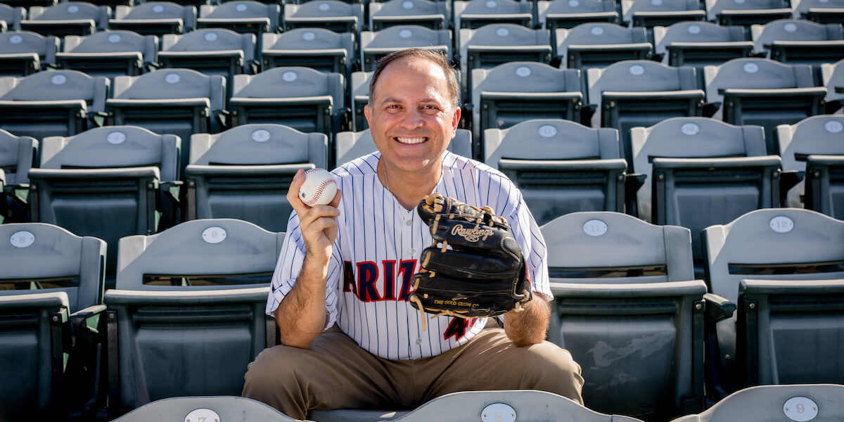 Ricardo Valerdi poses with a baseball at the Arizona Diamondbacks Stadium. (Photo/ Courtesy of Ricardo Valerdi).