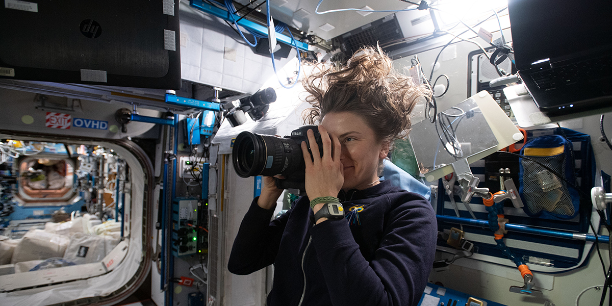 NASA astronaut Kayla Barron photographs sample location in the International Space Station for the Sampling Quadrangle Assemblages Research Experiment (SQuARE) Photo credit: NASA/International Space Station Archaeological Project