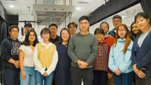 An image of Prof. Zaijun Chen (center) with team members of the Intelligent and Quantum Photonics group.