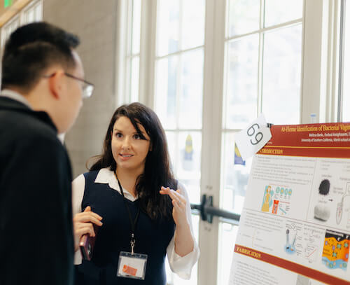 Ph.D. student in the Laboratory for Design of Medical and Analytical Devices, Melissa Banks during the Grodins poster presentations. Image Frank Ding
