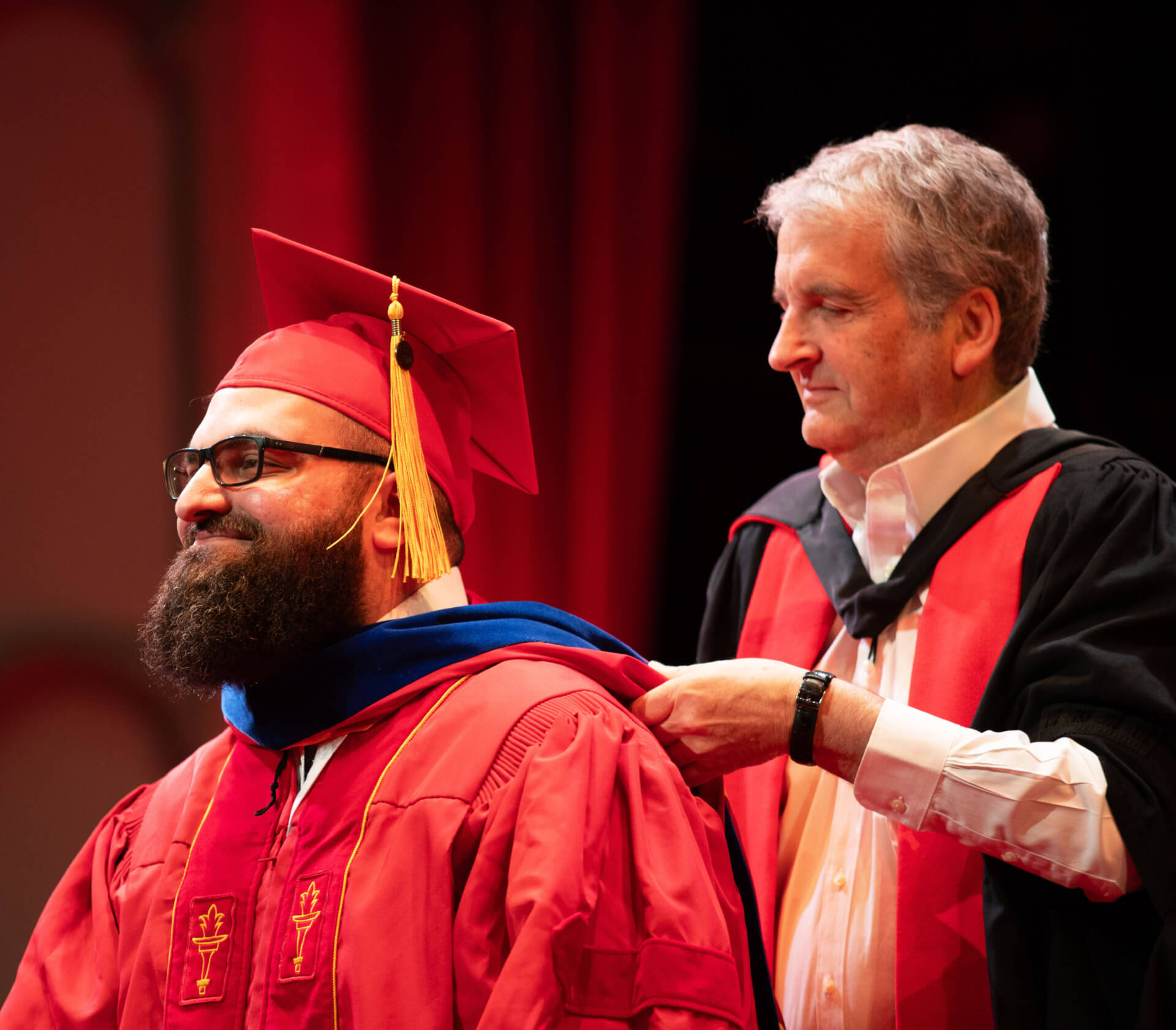 Hussein Hammoud receives his hood from Professor Tony Levi, chair of the Ming Hsieh Department of Electrical and Computer Engineering.