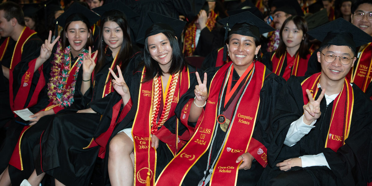 A group of 2024 USC Viterbi graduates at the commencement ceremony held at the Galen Center