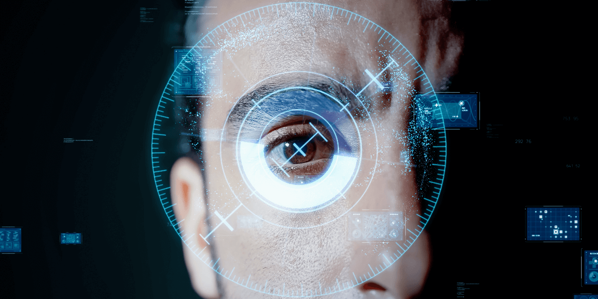 An image of a man's eye with a light blue digital scope superimposed on it