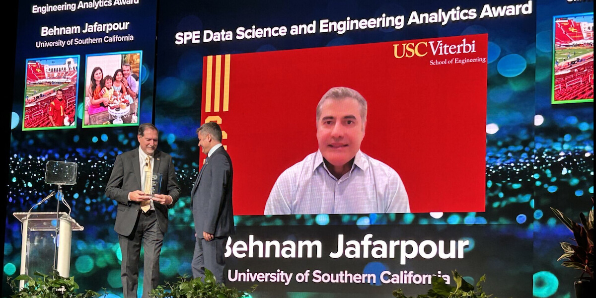 Professor in the Mork Family Department Behnam Jafarpour (R) receives his award from Society of Petroleum Engineers President Terry Palisch (L) on September 24 2024. Image/Sushma Bhan