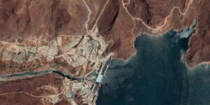 Satellite imagery of land mass meeting water which is the Grand Ethiopian Renaissance Dam