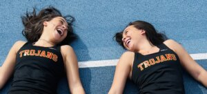Twins Gabrielle and Zoe Edwards, both USC Viterbi students, share a laugh in their track attire (Photo/Courtesy of Gabrielle Edwards)