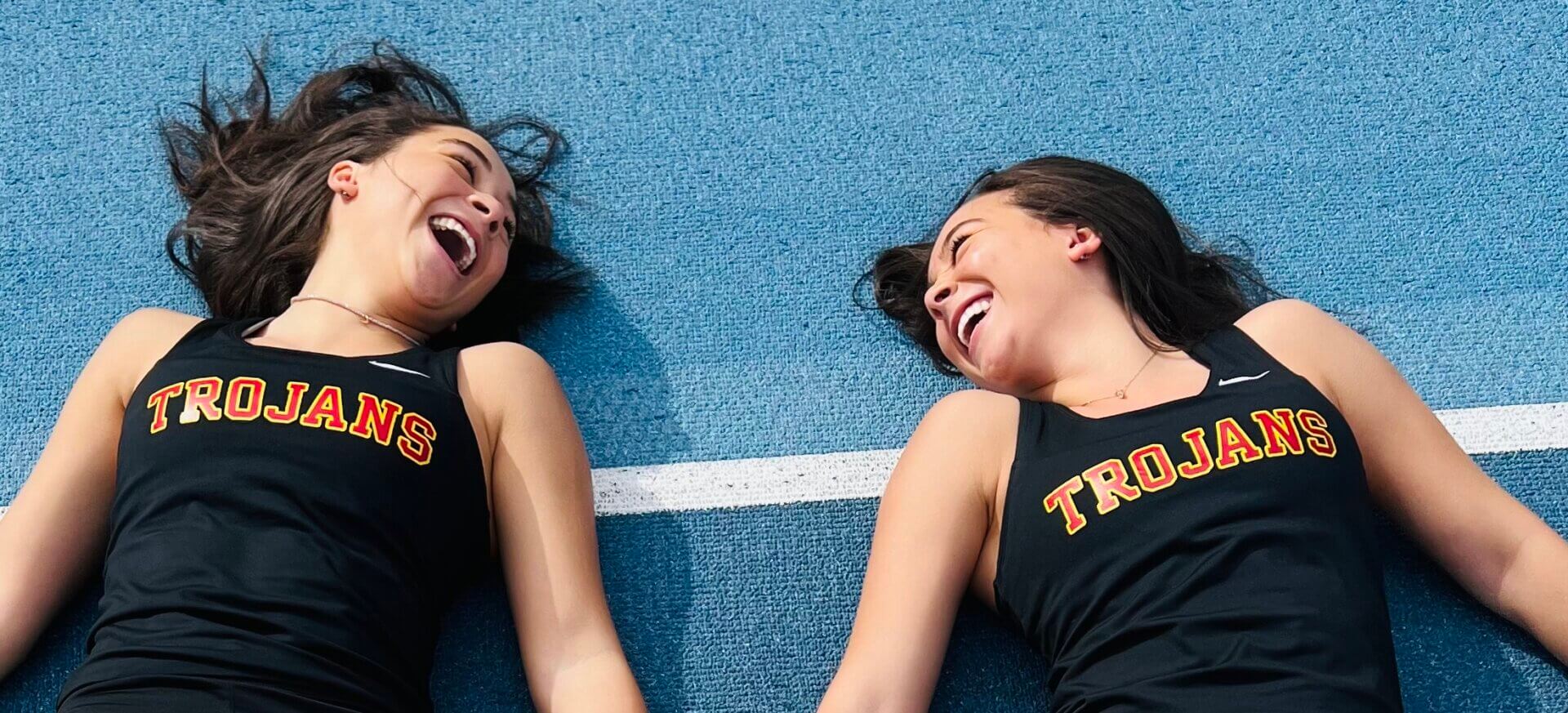 Twins Gabrielle and Zoe Edwards, both USC Viterbi students, share a laugh in their track attire (Photo/Courtesy of Gabrielle Edwards)