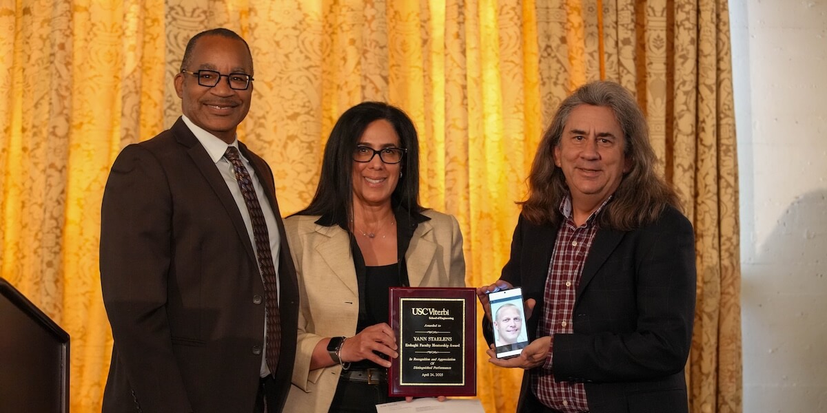 (Left to Right) Timothy Pinkston, Vice Dean for Faculty Affairs, Marsha Ershaghi, adjunct professor of management and organization, and Paul Ronney, chair of the Department of Aerospace and Mechanical Engineering, who is holding a picture of Yann Staelens (Photo/Dani Orlando)