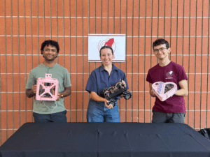 Student leaders from USC Makers holding products from past projects