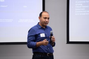 Ahmed Sadek, Head of Physical AI Systems and VP of Engineering at Qualcomm, delivering the Keynote Address (Photo/Braden Dawson)