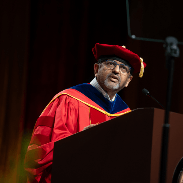 Executive Vice Dean and Director of the USC Mark and Mary Stevens School of Computing and AI, Gaurav Sukhatme delivering remarks at the 2026 Undergraduate Commencement (Photo Credit: Magali Gruet)