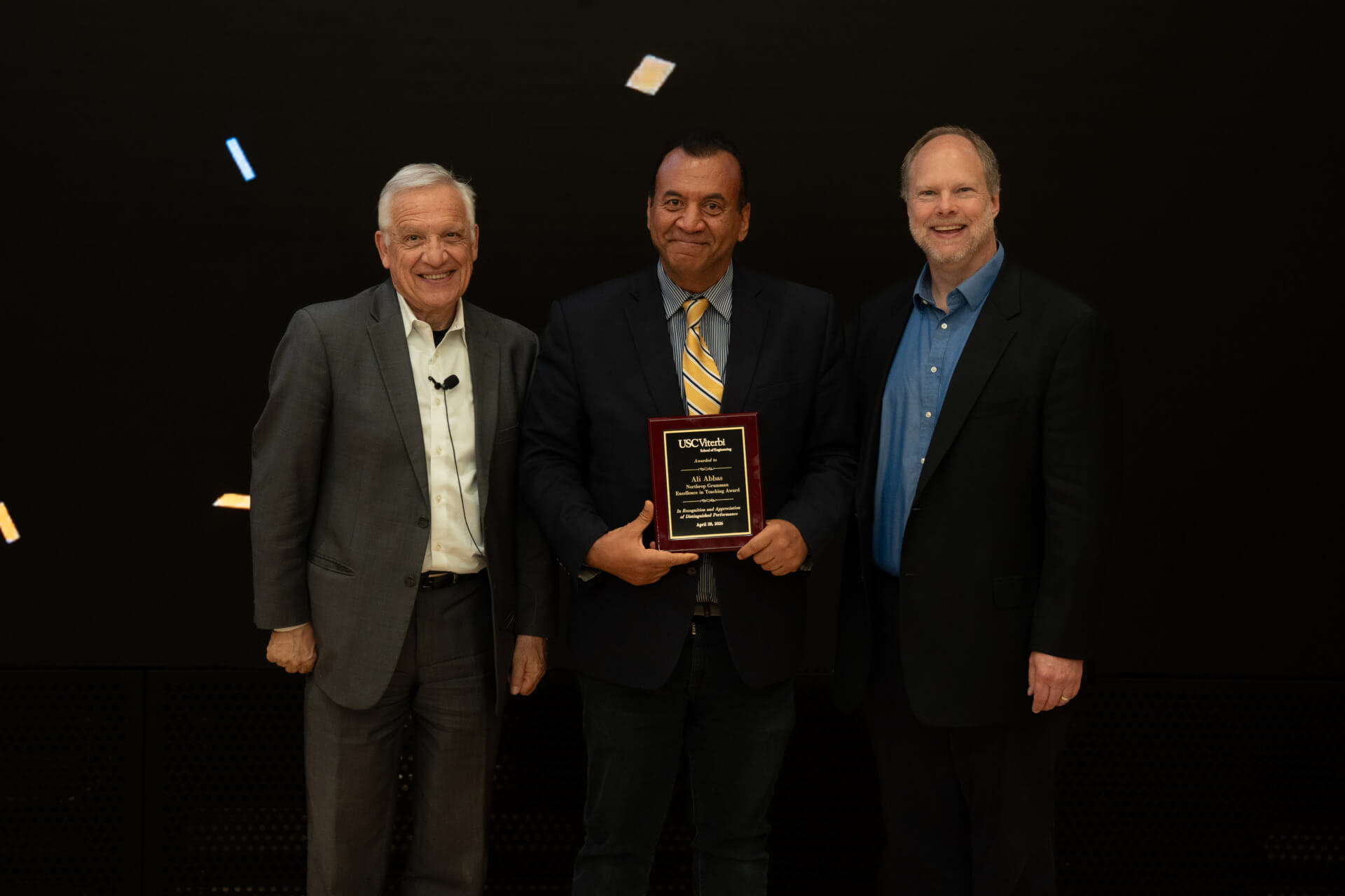 Dean Yannis C. Yortsos and Erik Johnson present the Northrop Grumman Excellence in Teaching Award to Ali Abbas