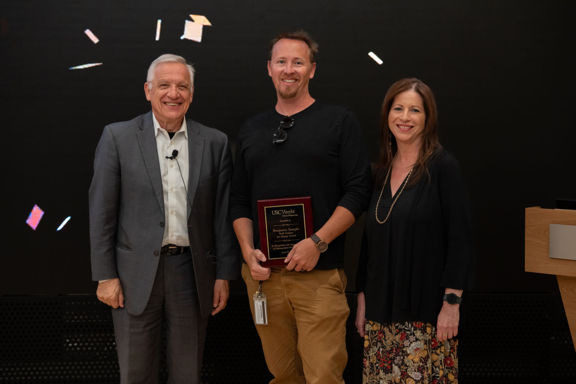 Dean Yannis C. Yortsos presents the Catalyst for Change Award to Ben Sample with Kimberly Bregenzer