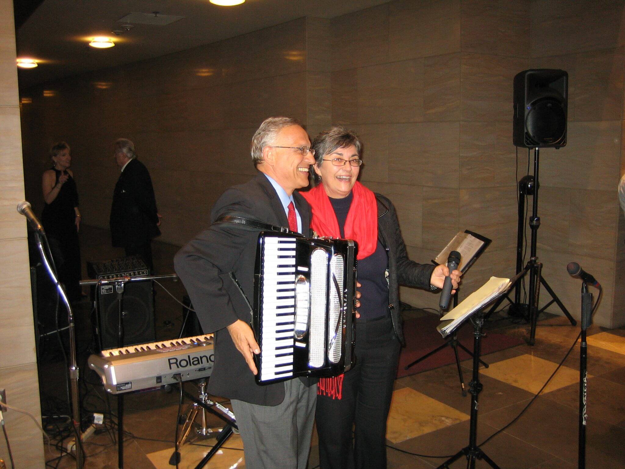 Musical duo: accordionist Dean Yannis Yortsos with vocalist Diane Demetras at a USC Viterbi holiday party. 